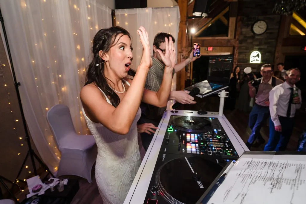 Bride behind the DJ Booth